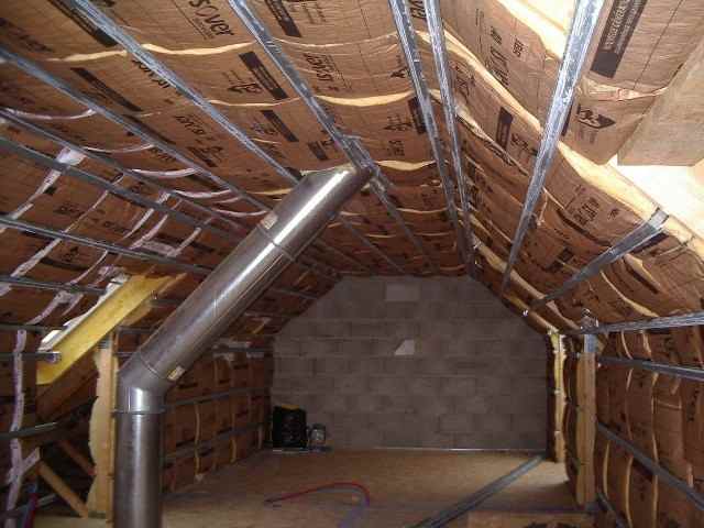 Travaux d'agrandissement d'aménagement de combles d'une maison